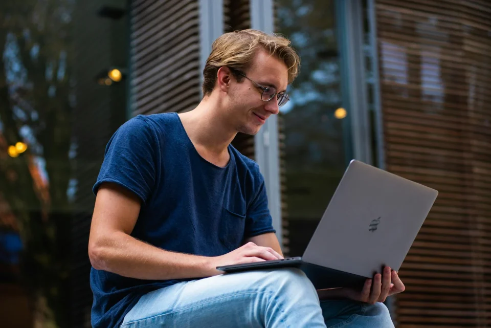 photo by buro millennial Selective Focus Photo of Man Using Laptop