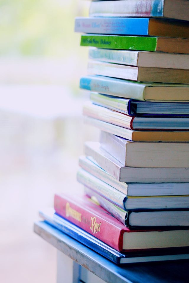 photo by alexander grey Selective Focus Photo of Pile of Assorted-title Books